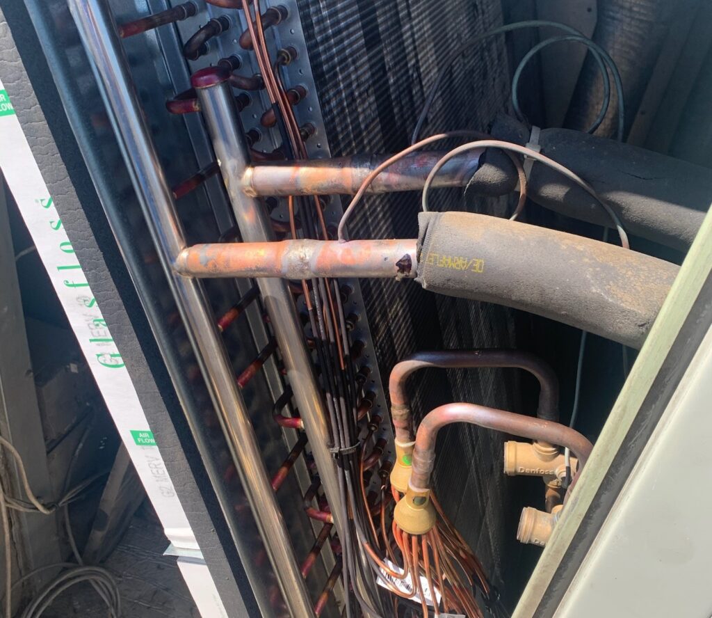 Electrician performing diagnostic testing on a commercial electrical system in Dallas